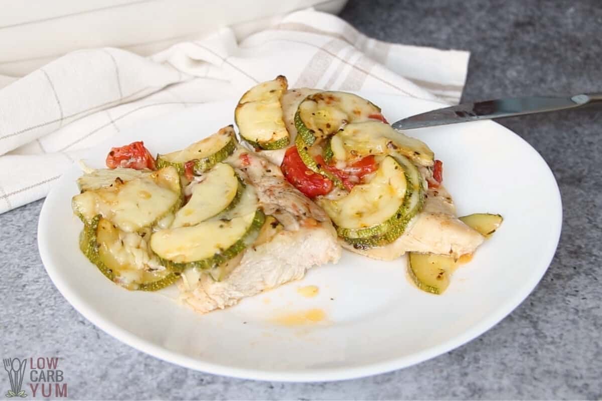 cut serving of chicken and zucchini bake on white plate