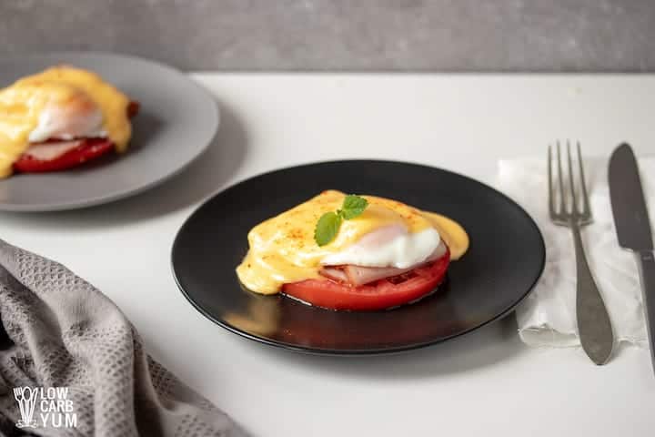 serving poached eggs with hollandaise sauce