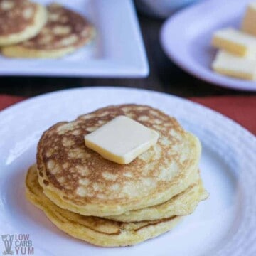 Coconut Flour Pancakes on plate with slice of butter on pancake