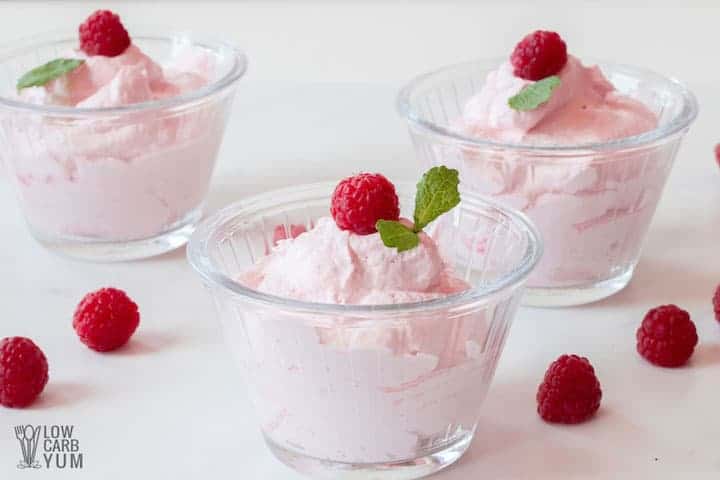 pink dessert in cups