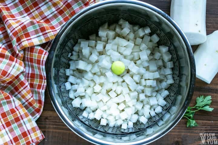 daikon radish in steamer basket