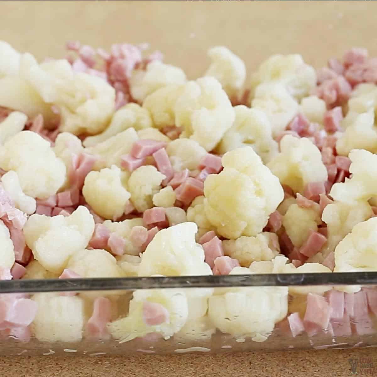 cauliflower and ham in casserole dish.