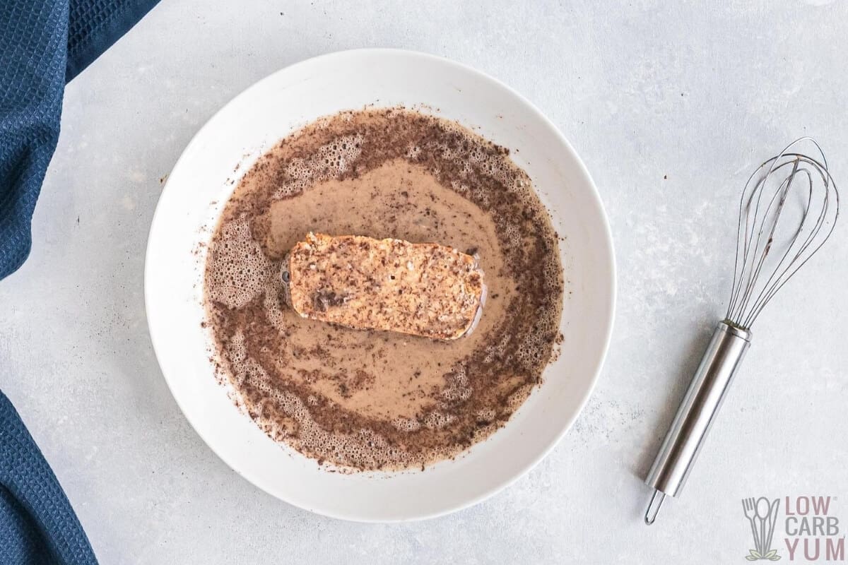 dipping low-carb bread in cinnamon egg mixture