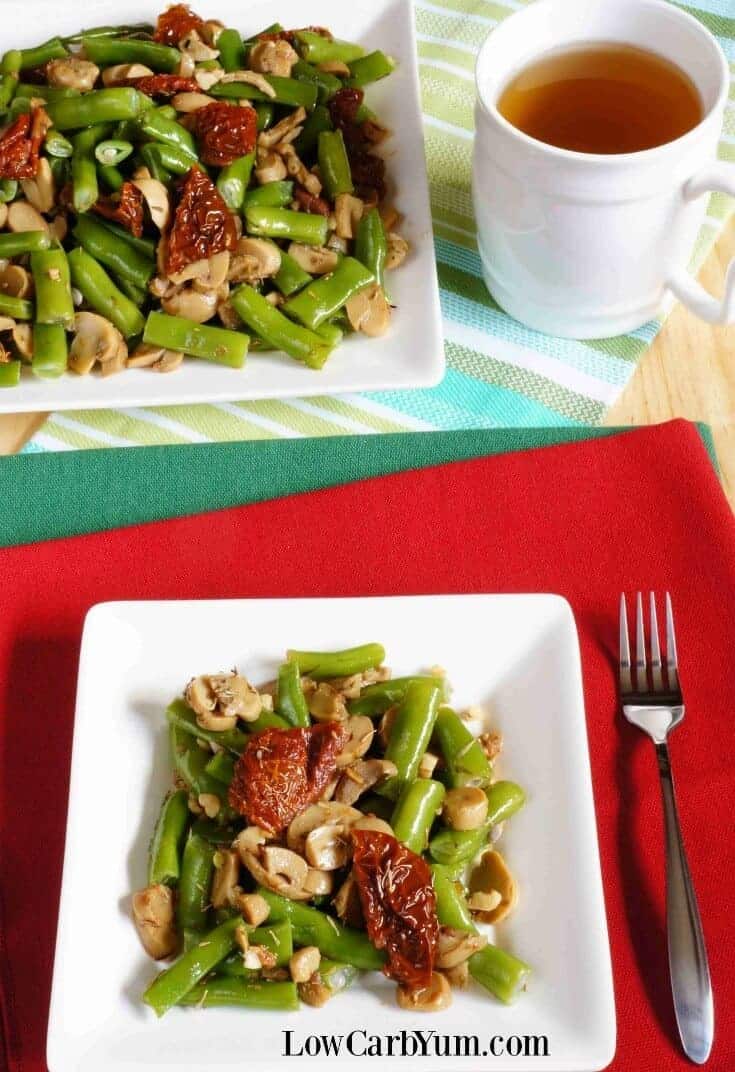 keto mushrooms are served with green beans on white plates
