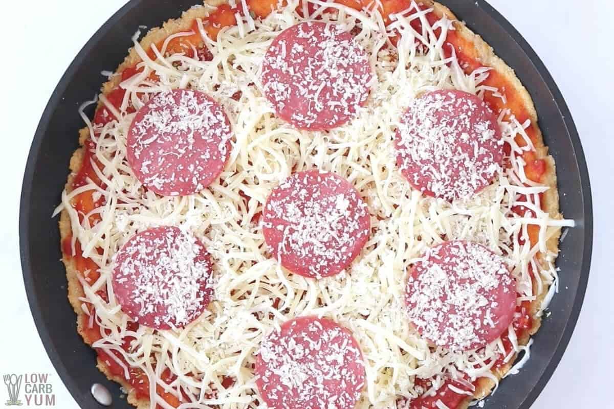 unbaked keto deep dish pizza in skillet