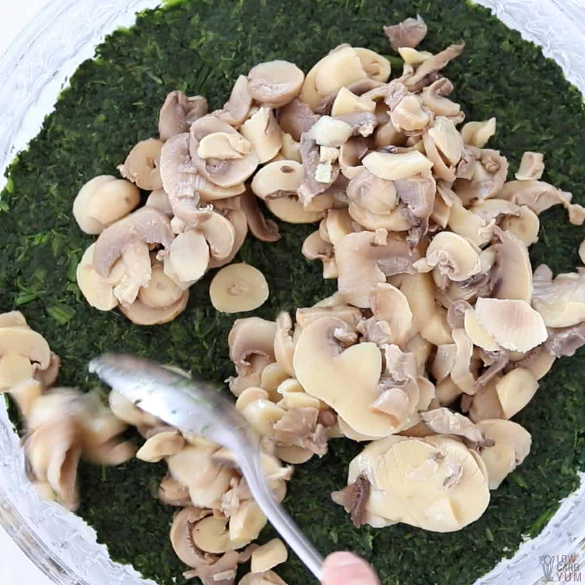 adding mushrooms over spinach.