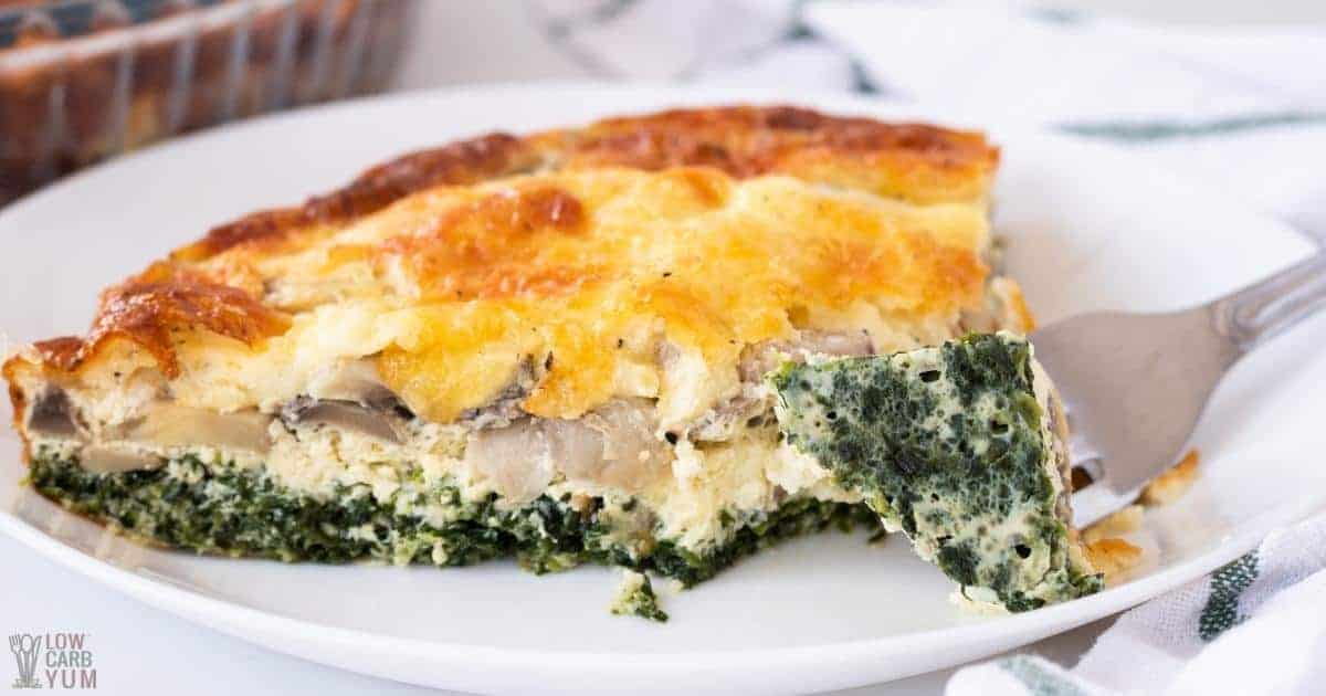 fork bite of spinach mushroom quiche slice.