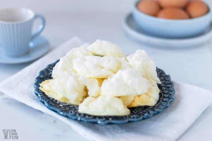 sugar-free meringue cookies with teacup and bowl of eggs