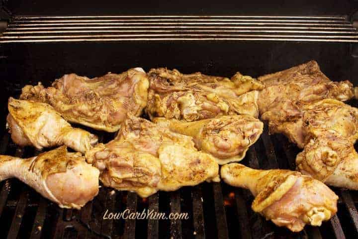 Marinated chicken cooking on grill