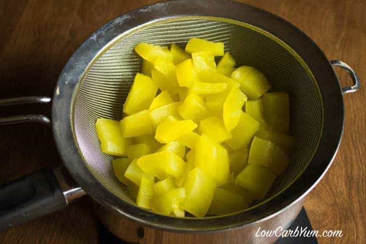 Cooked yellow squash draining