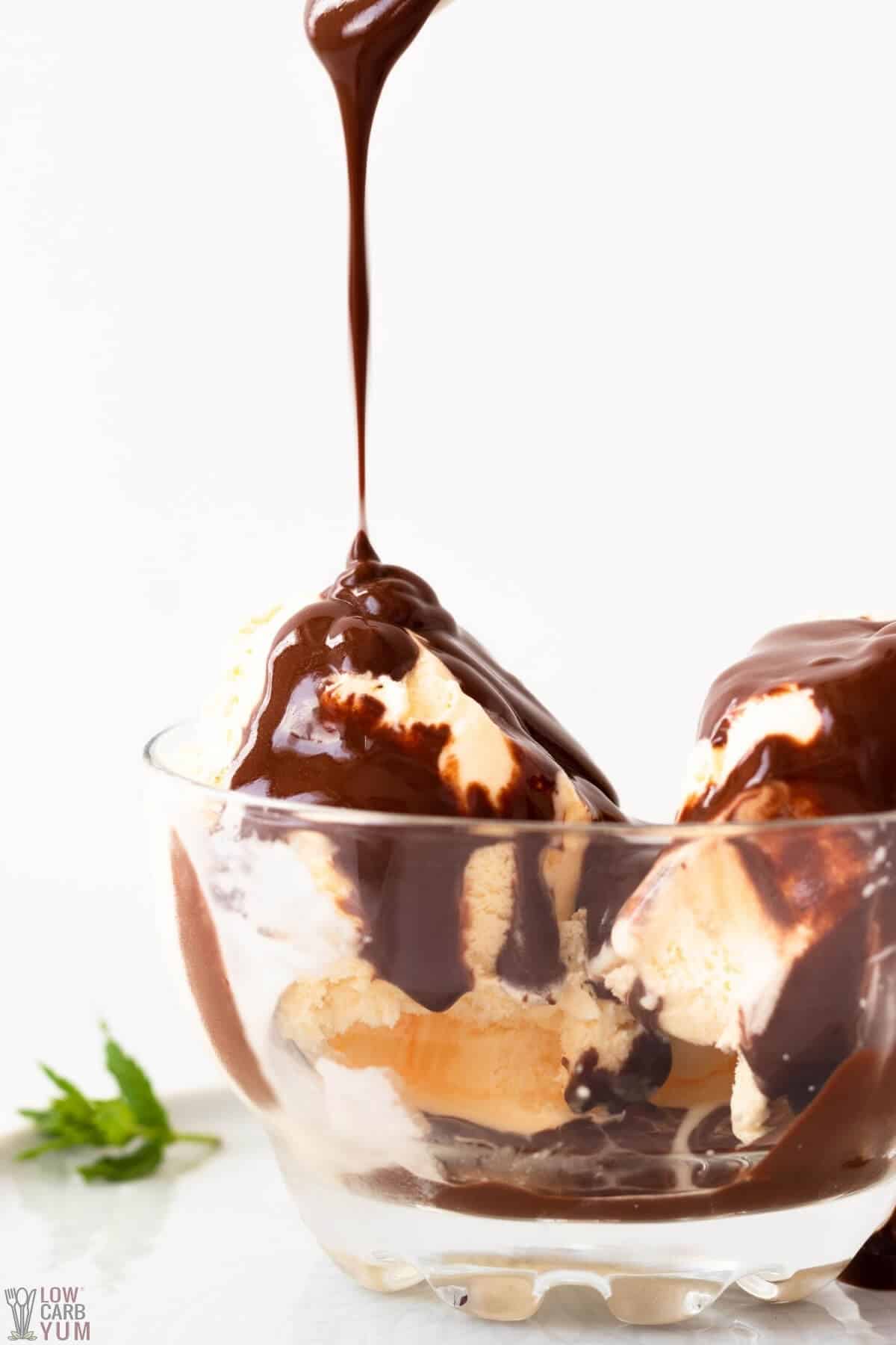 pouring low-carb chocolate syrup sauce over ice cream