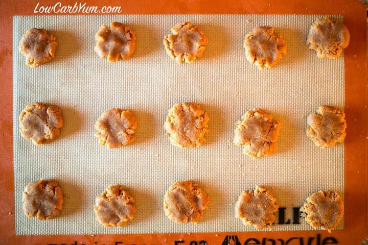 Flatted cookie dough on lined baking pan