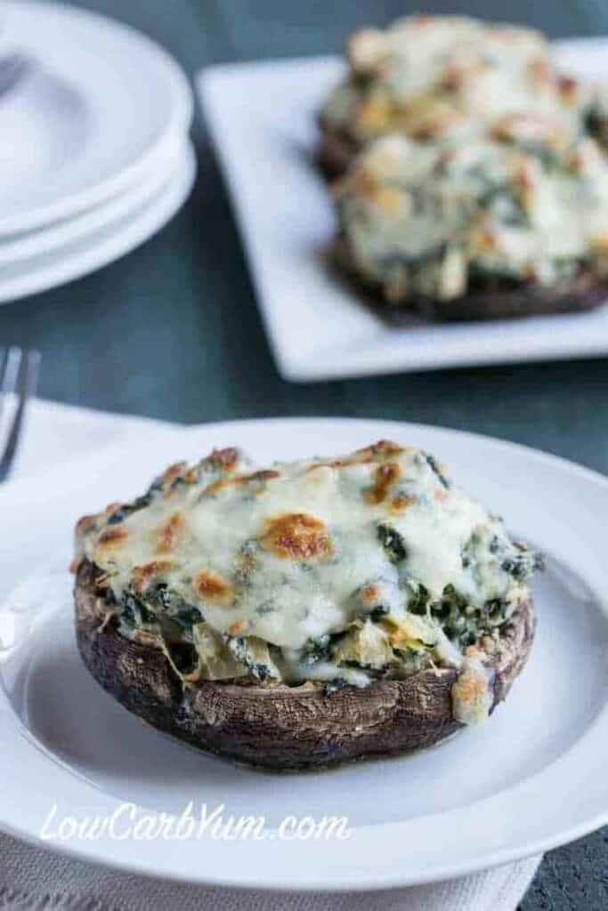 Closeup of a single stuffed portobello on plate