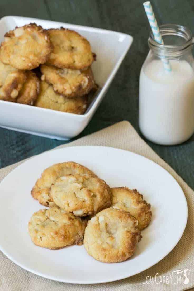 keto white chocolate macadamia nut cookies in bowl with glass of milk