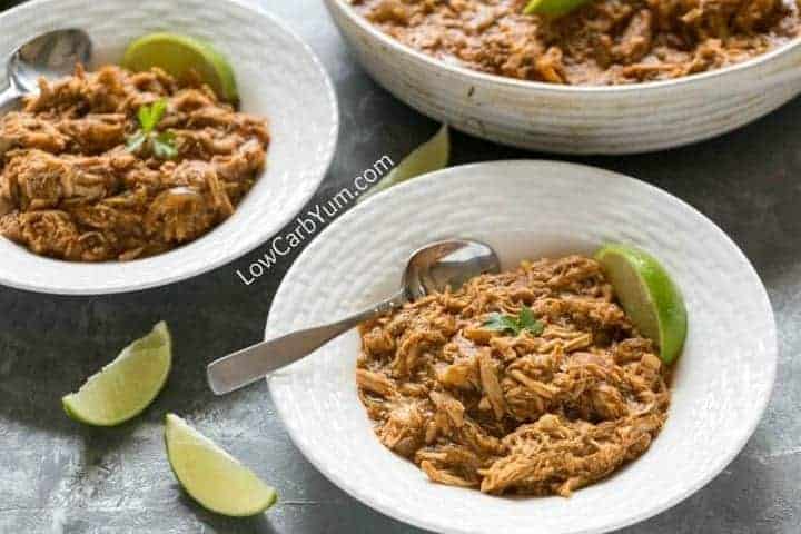 Slow-cooked salsa verde chicken in bowls with lime