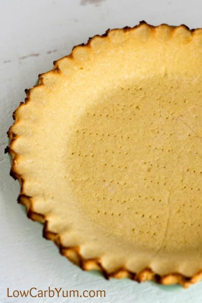 Want the perfect low carb pie crust that isn't made with almond flour? Give this simple coconut flour pie crust a try for both sweet and savory pies. | LowCarbYum.com