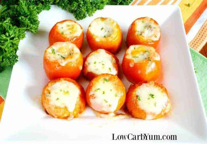 Cheese stuffed tomatoes with ground meat on plate