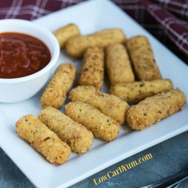 low carb gluten free mozzarella sticks with sauce on plate