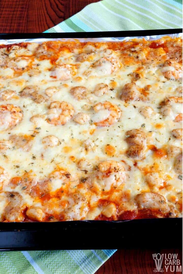 Cauliflower sheet pan pizza with fish, shrimp, and scallops