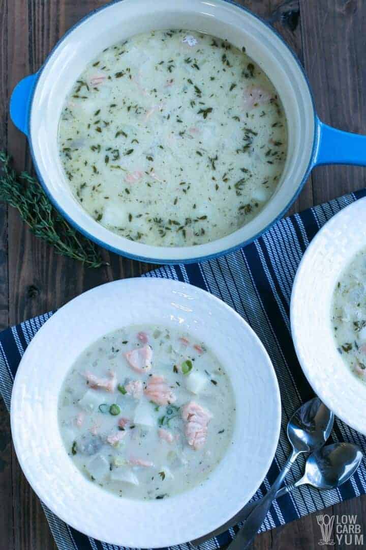 salmon chowder with coconut milk in bowl and pot
