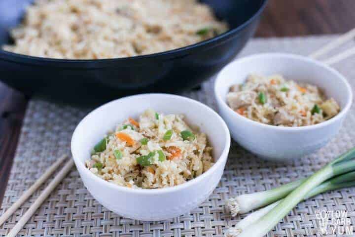 cauliflower pork fried rice in bowls and skillet