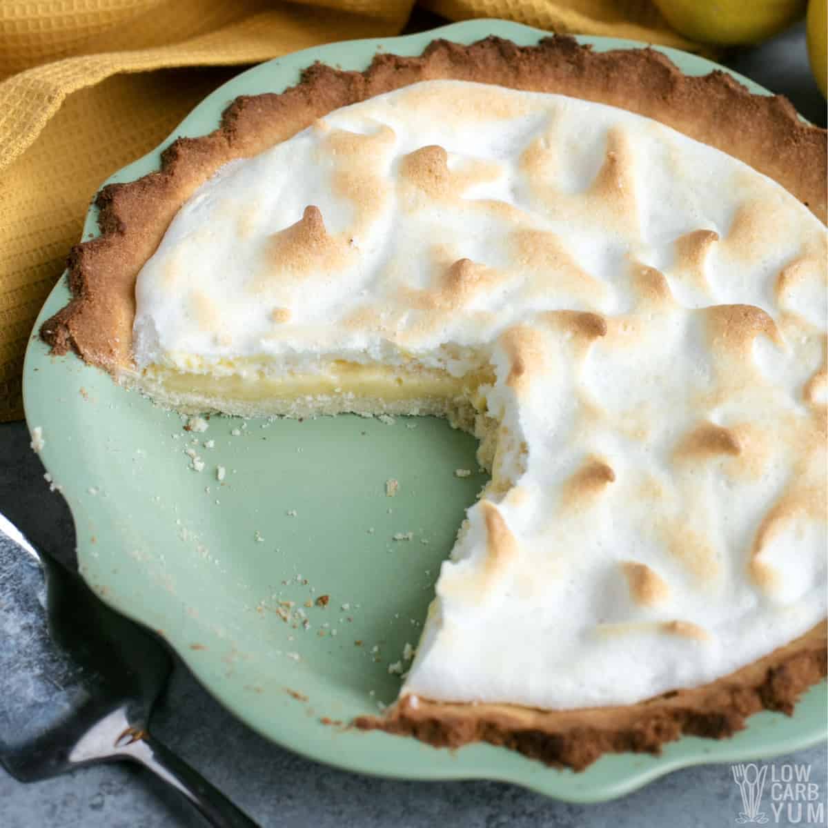 keto lemon meringue pie with slices missing.
