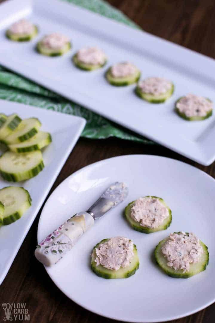 Serving smoked salmon pate with cream cheese on cucumber slices