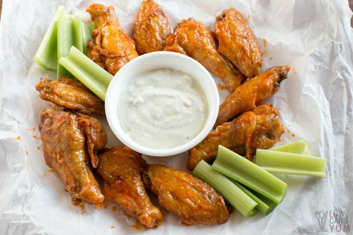 Air fryer chicken wings with buffalo sauce and celery
