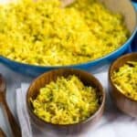 Serving turmeric cabbage rice in bowls