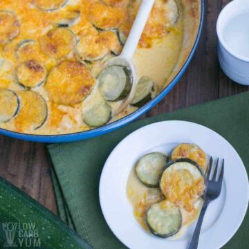 zucchini au gratin bowl and served on plate with fork