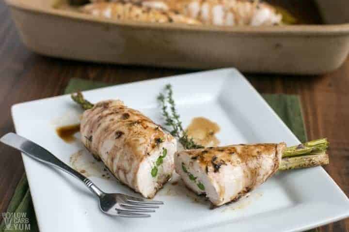 Sliced asparagus stuffed chicken on plate