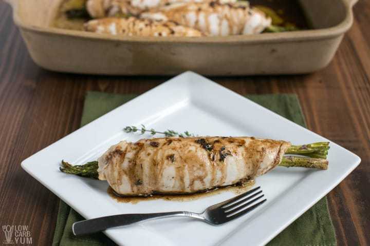 Uncut asparagus stuffed chicken on plate