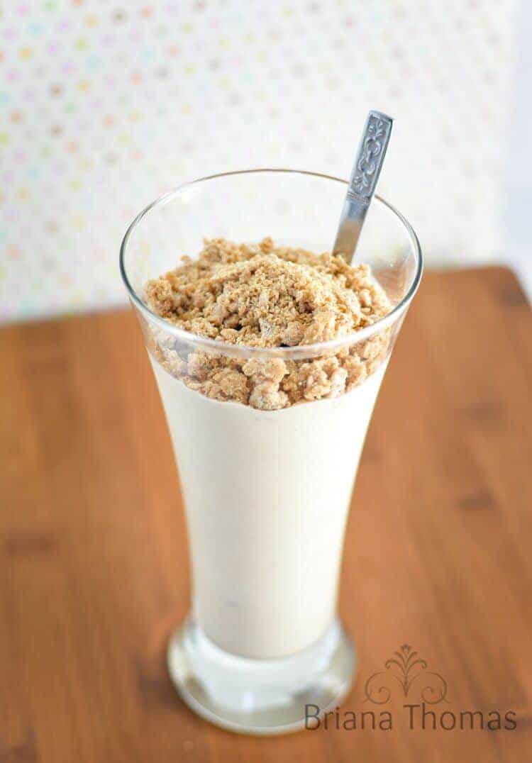 Cookie Dough Whiteout Smoothie in tall glass with spoon