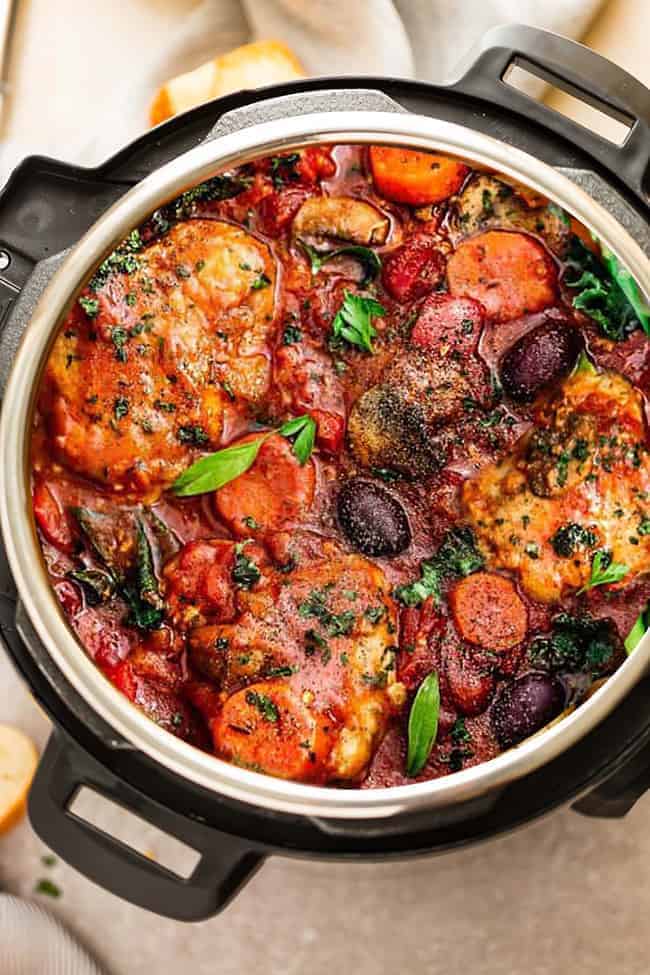 vertical close up image of chicken cacciatore in instant pot