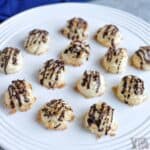 keto coconut macaroons on round white platter.