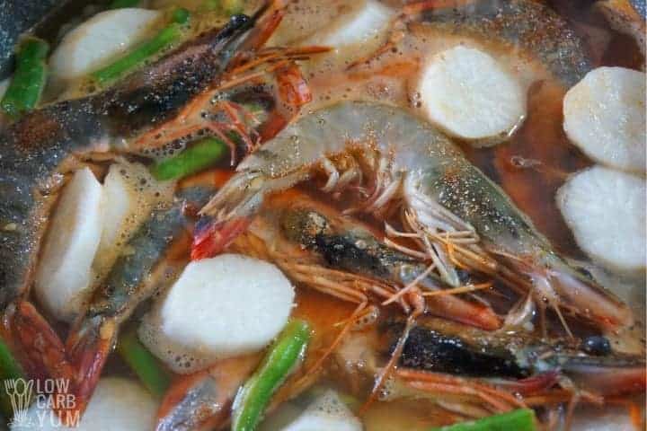 adding shrimp to sinigang na hipon