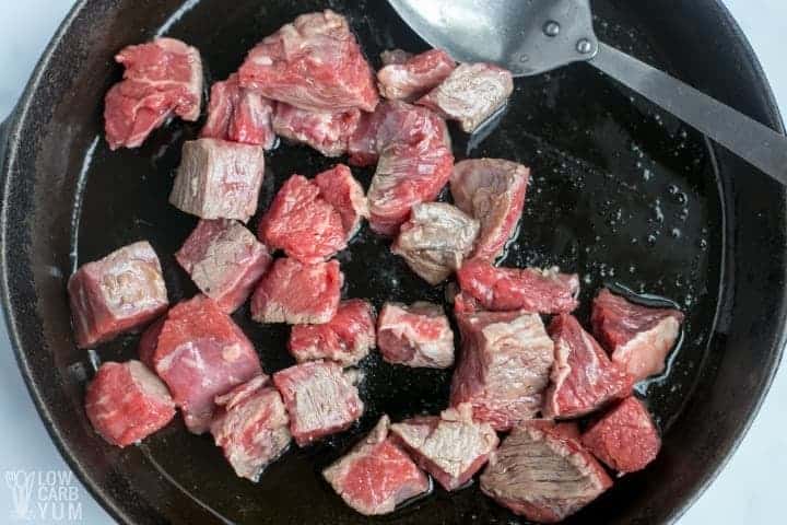 browning sirloin steak tips in skillet