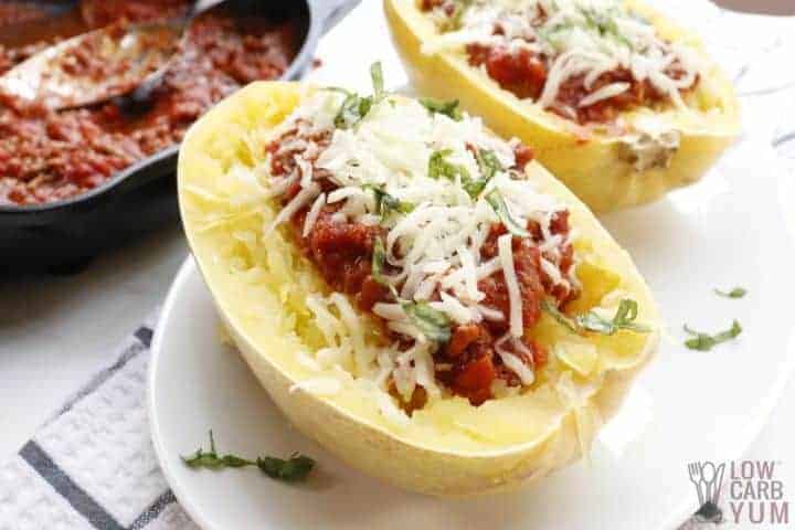 spaghetti squash halves with sauce and cheese