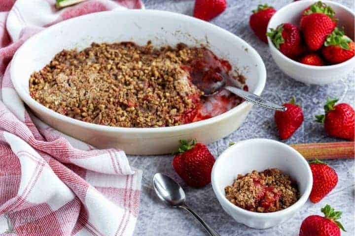 strawberry rhubarb crisp in baking pan and bowl