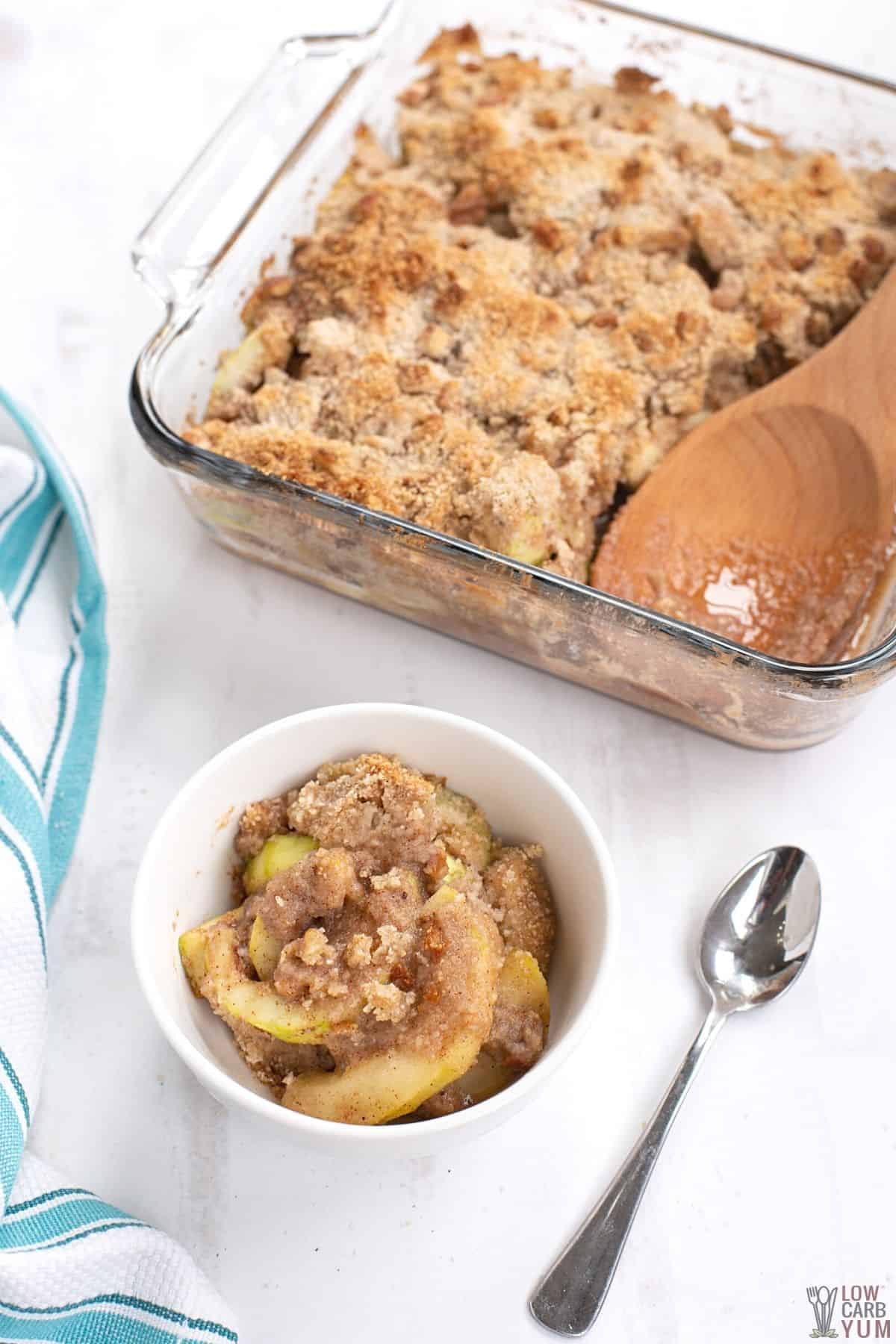 keto apple crisp serving in small white bowl.