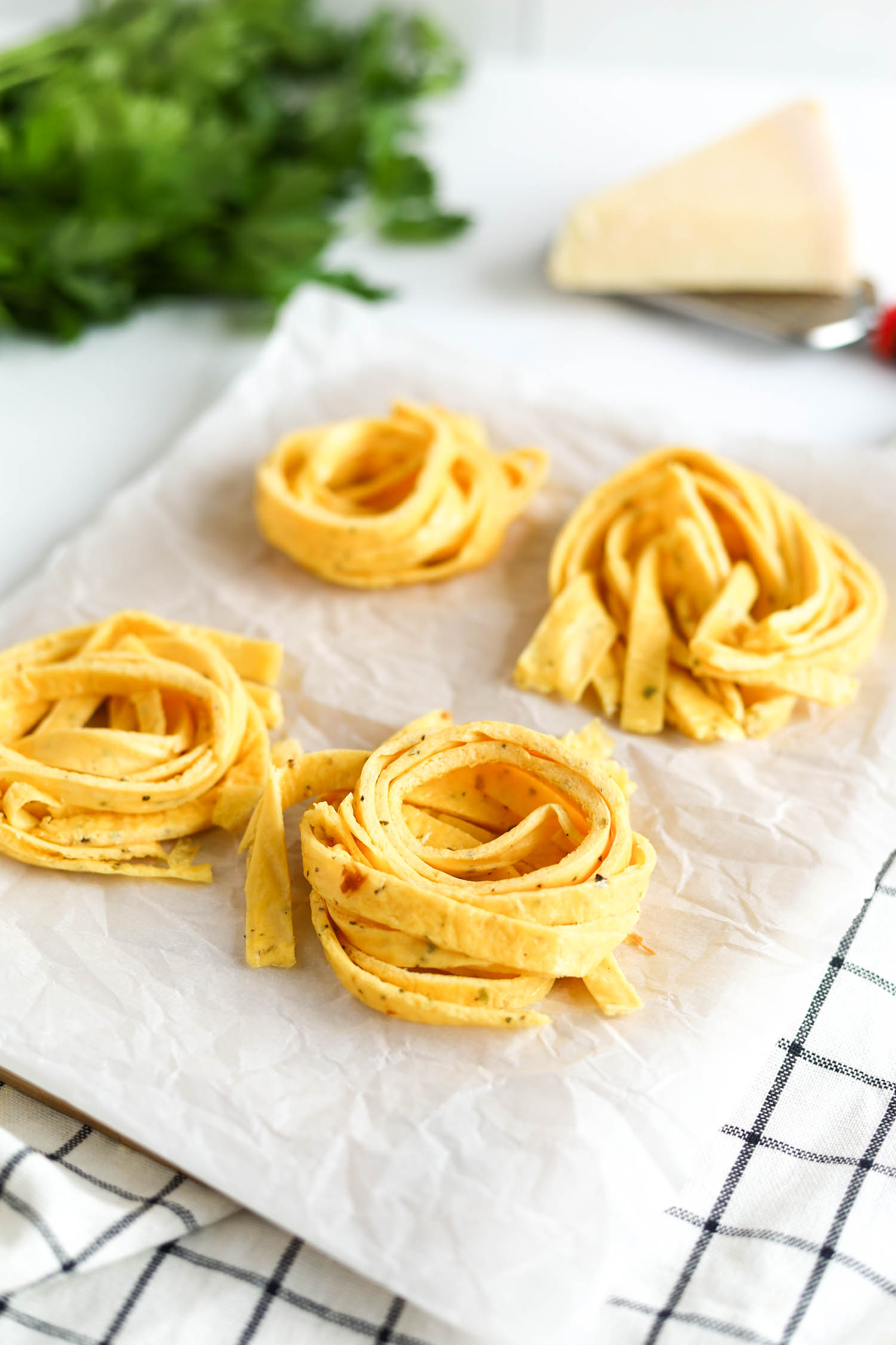 pasta noodles rolled into single servings on a cookie sheet 