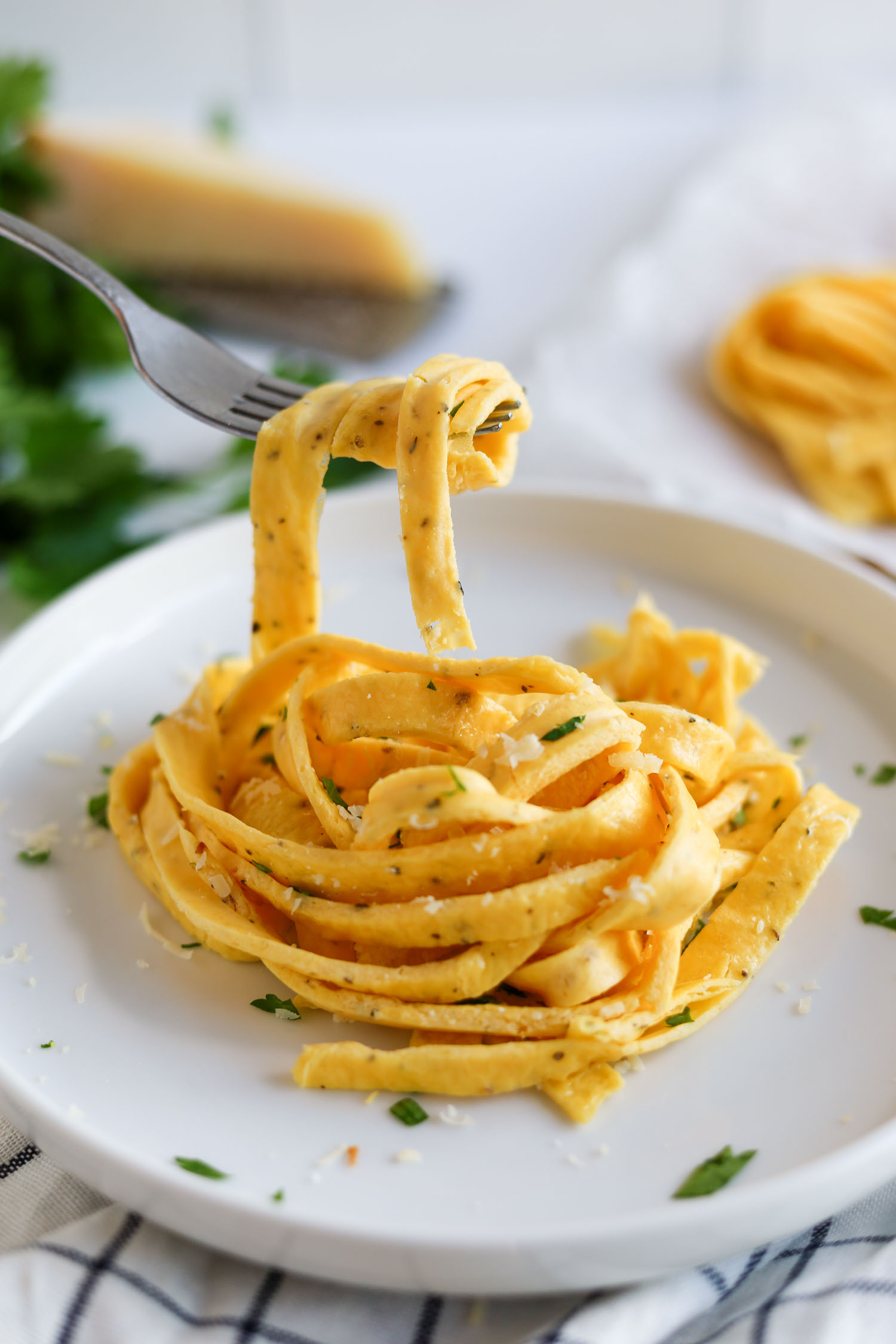 taking a bite of keto noodles with a fork