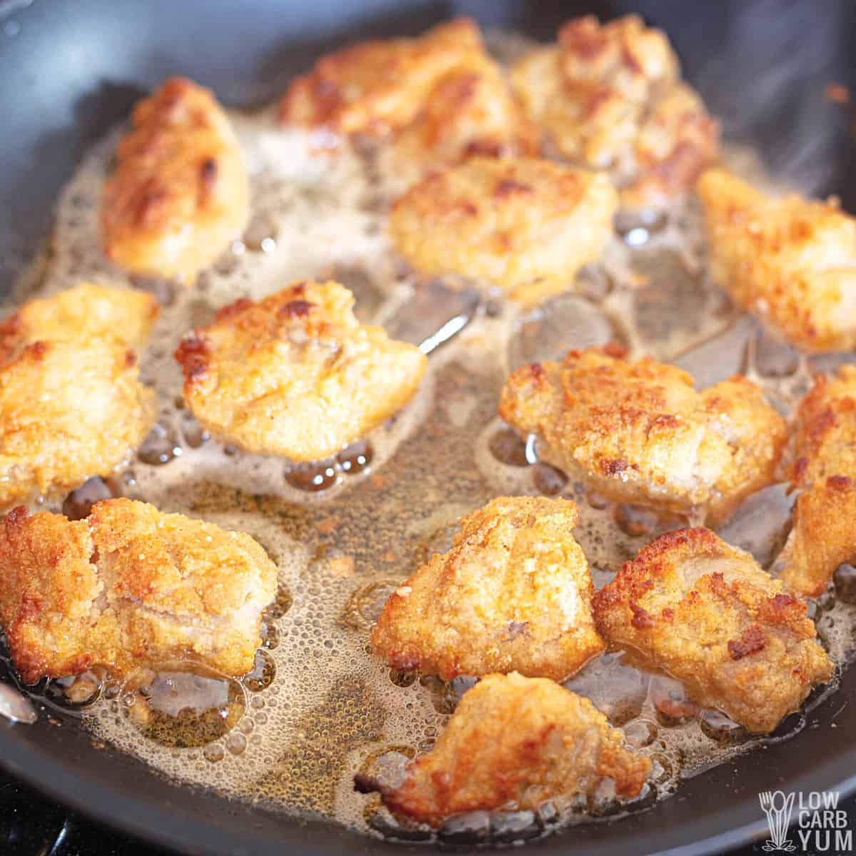 frying baked keto nuggets in oil.