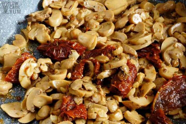 mushrooms, tomatoes, and seasonings in skillet