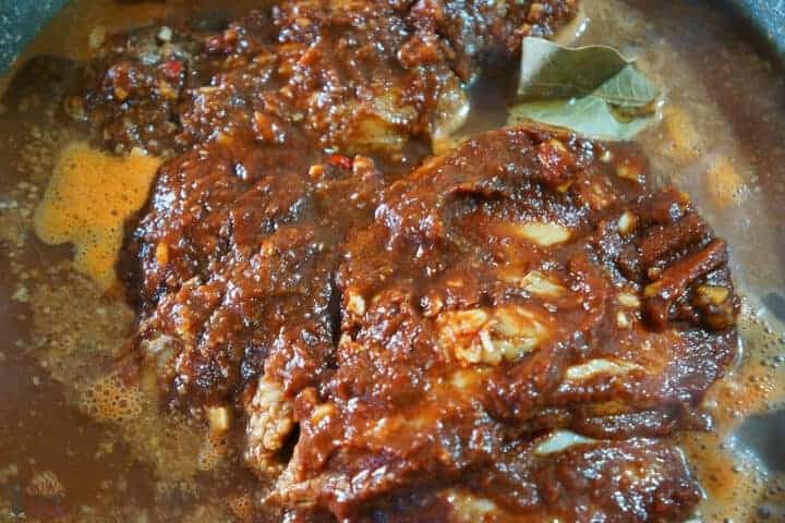 simmering pork in pot