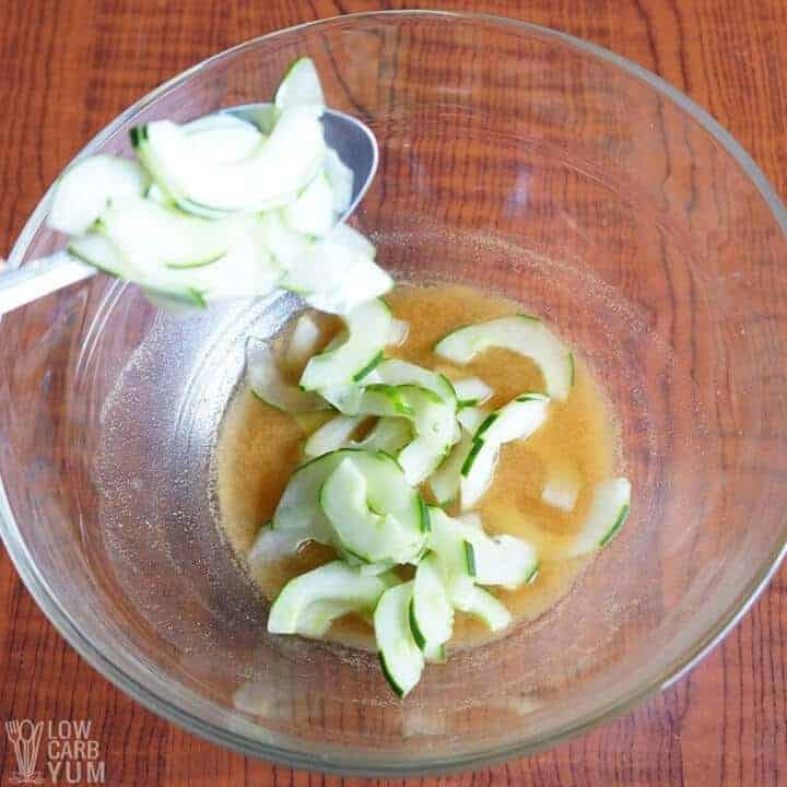 adding cucumbers to vinegar mixture