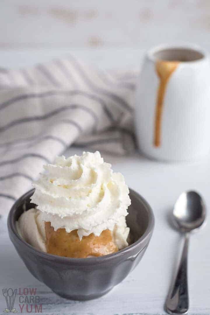 keto peanut butter sauce recipe served with ice cream and whipped cream.