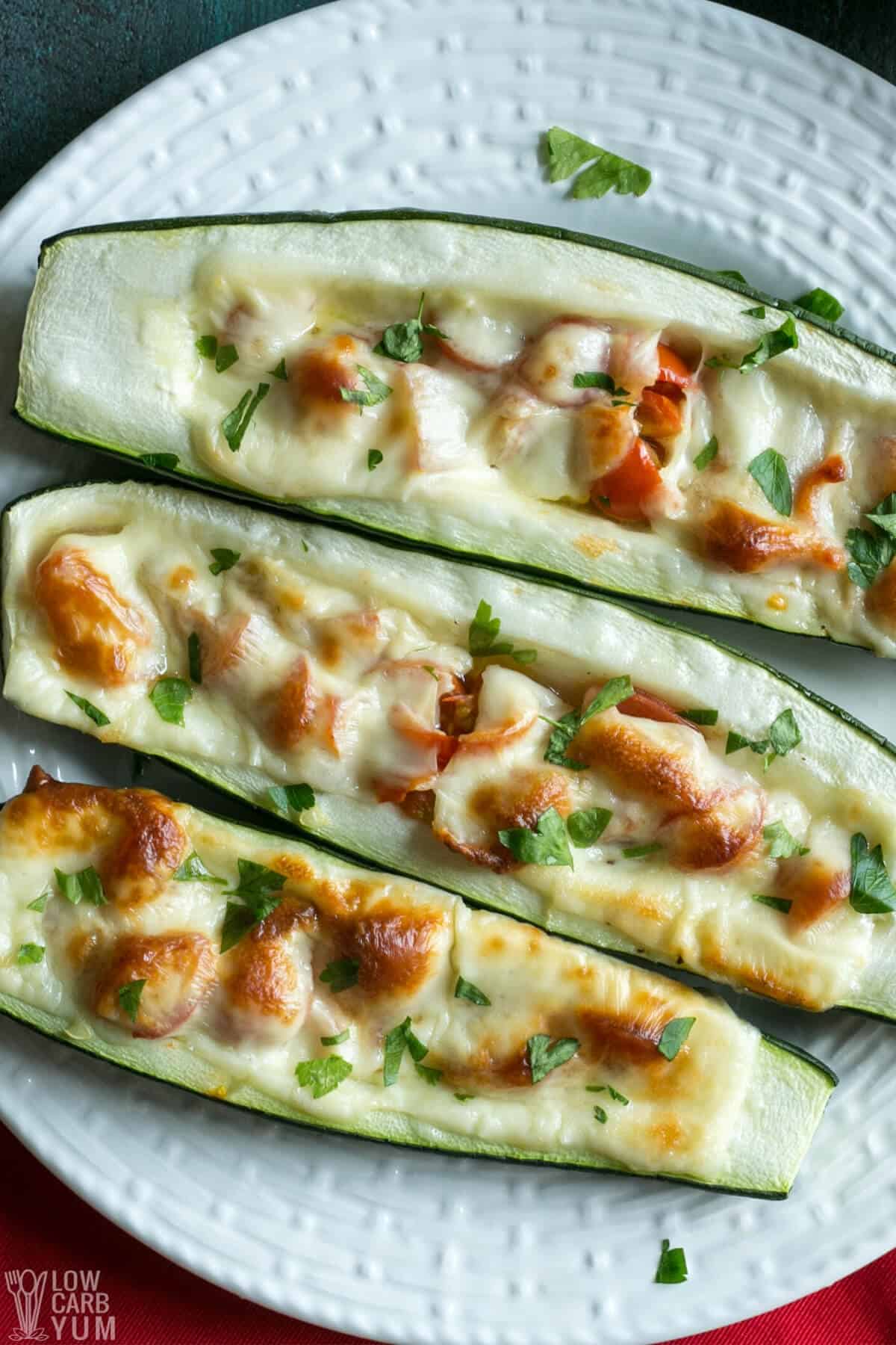zucchini boats with toppings on plate