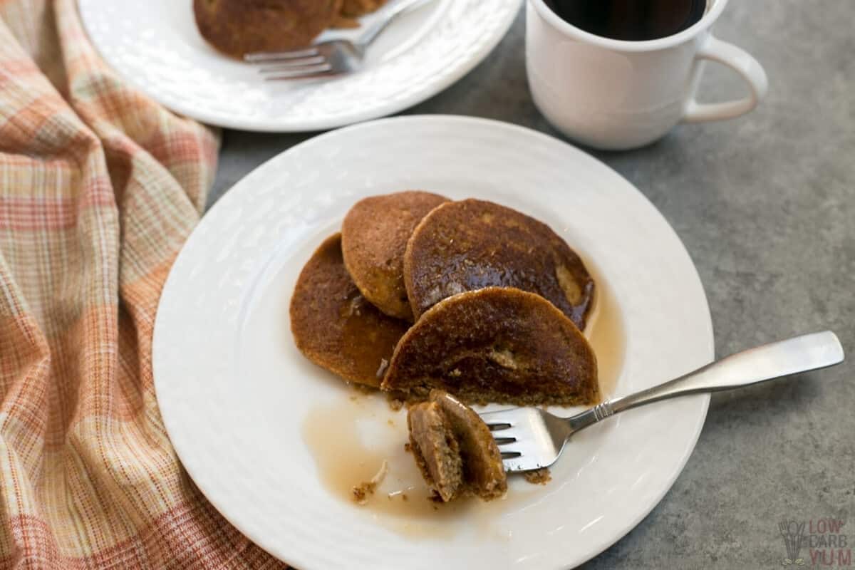 almond flour pumpkin pancakes with fork bite