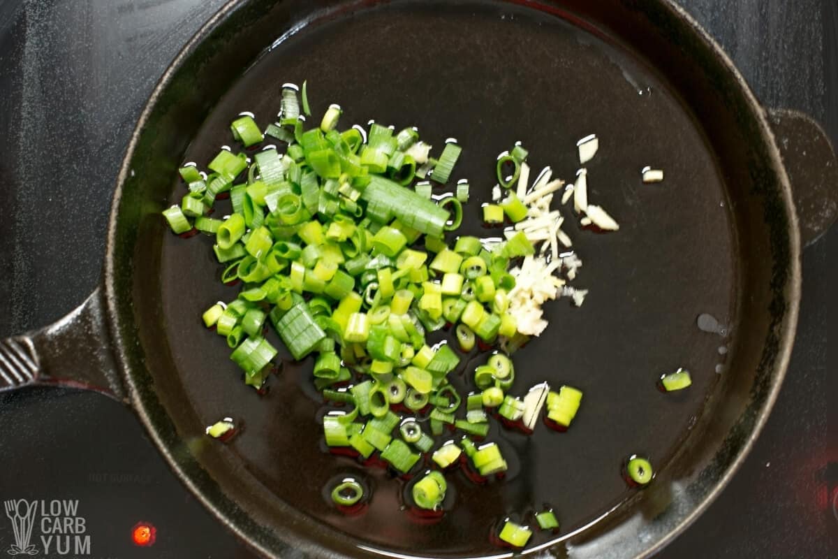 garlic ginger and green onions in pan